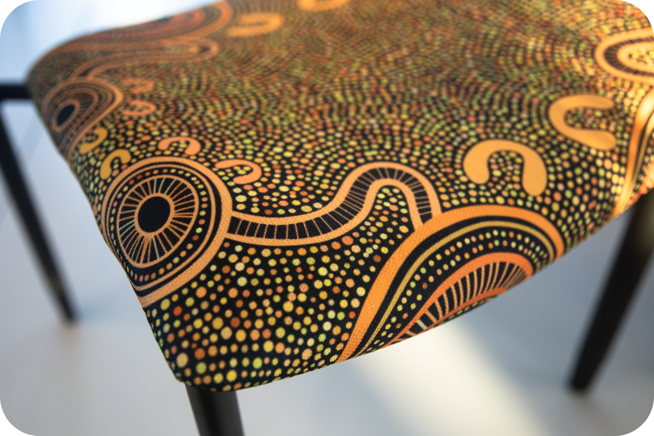 Curved grey upholstered piece